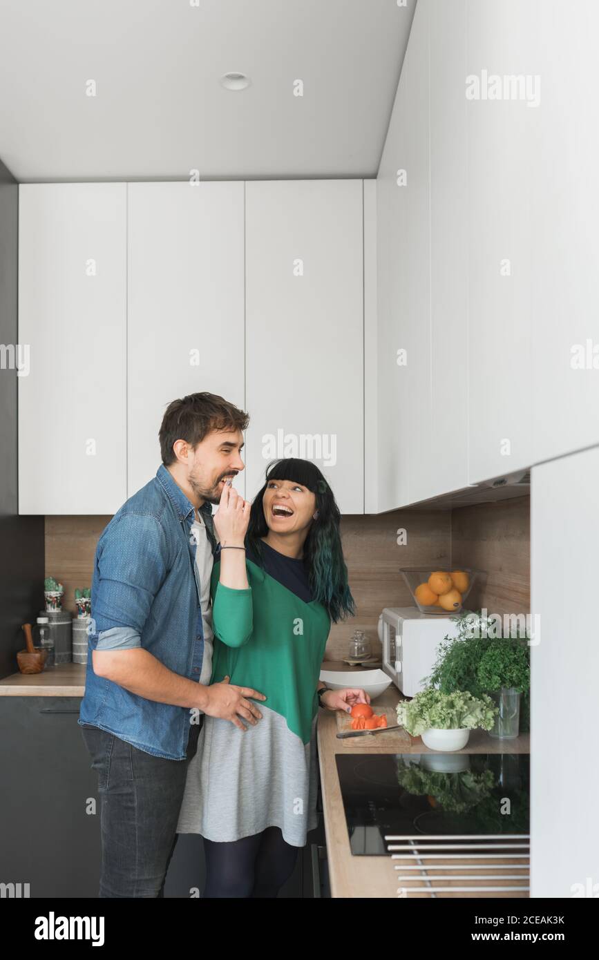 Excited couple in kitchen hi-res stock photography and images - Alamy