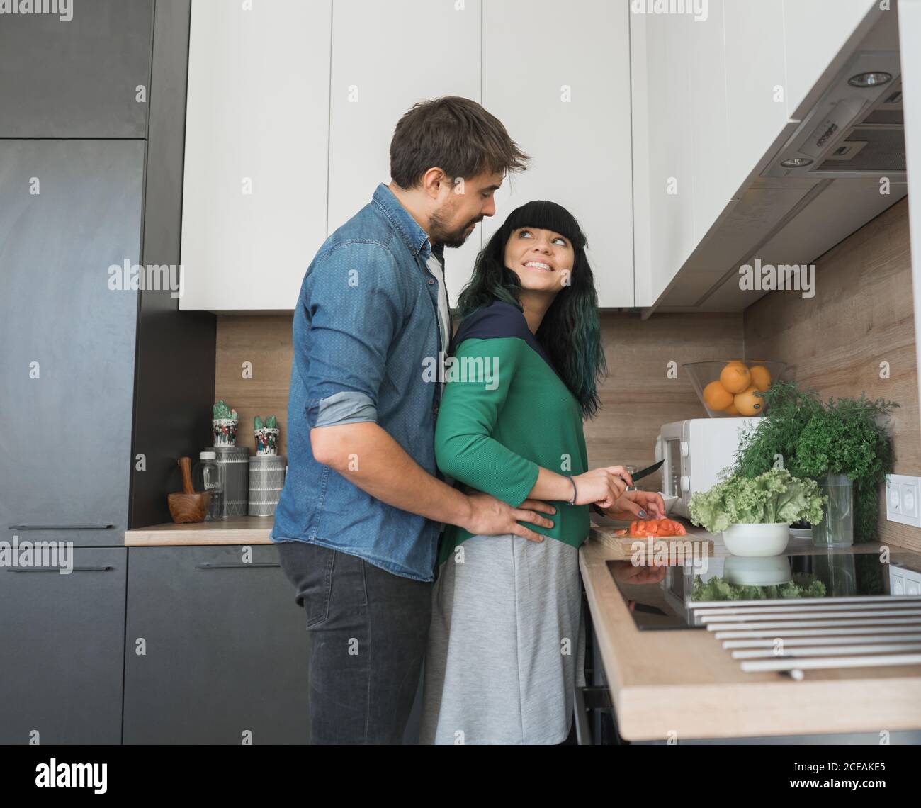 Excited couple in kitchen hi-res stock photography and images - Alamy