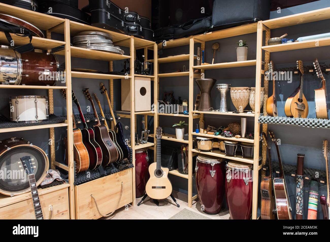 Shelf with drums and guitars Stock Photo