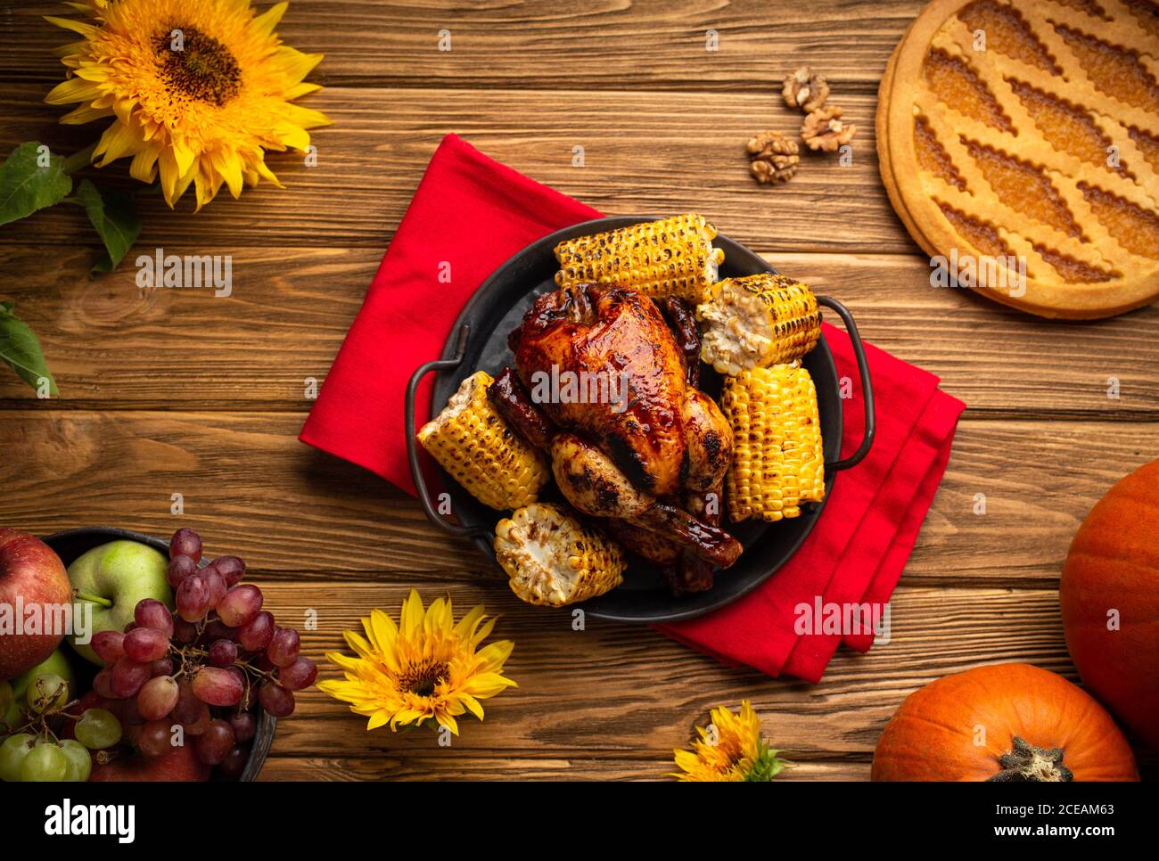 Thanksgiving festive table composition with roasted turkey, pumpkin pie ...