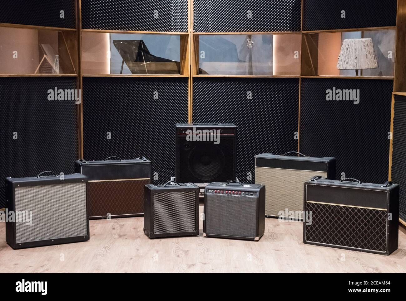 Set of amplifiers near piano Stock Photo