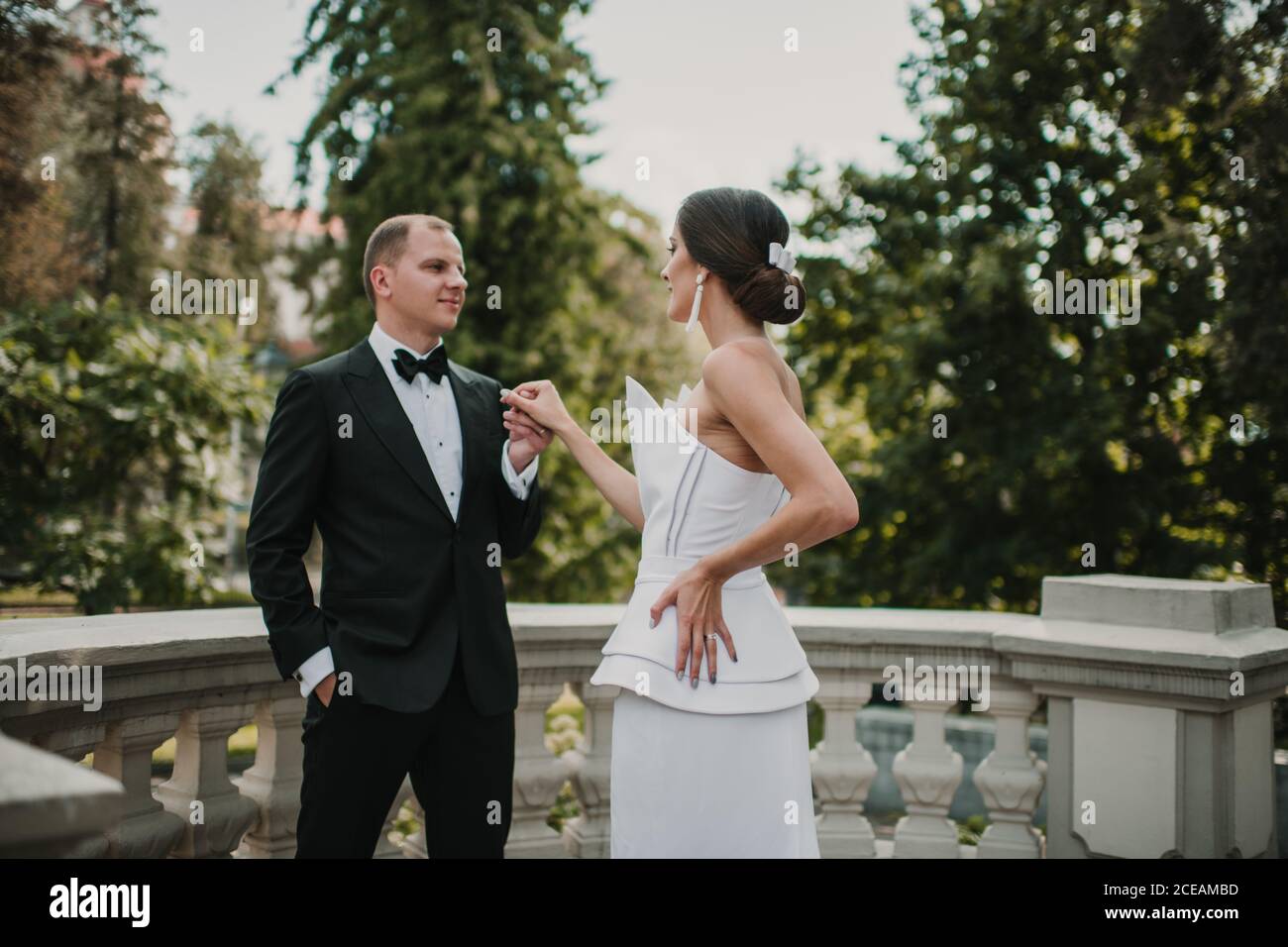 Young bride posing near groom Stock Photo