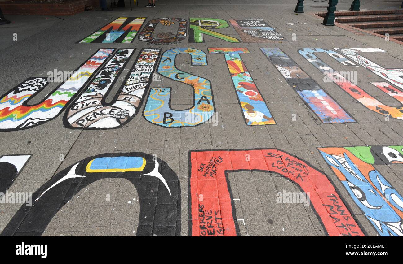 Victoria, British Columbia, Canada, 31-Aug-2020 - Victoria Police Department Chief Del Manak is calling a recently painted ‘“More Justice, More Peace” mural in downtown Bastion Square that includes an offensive acronym ACAB (All Cops Are Bastards) deeply disrectful to local police. The mural was painted by a group of 17 artists and was intended to raise awareness of  injustices felt by Black and Indigenous communities. The mural was funded by a city grant. Don Denton/Alamy Live News Stock Photo