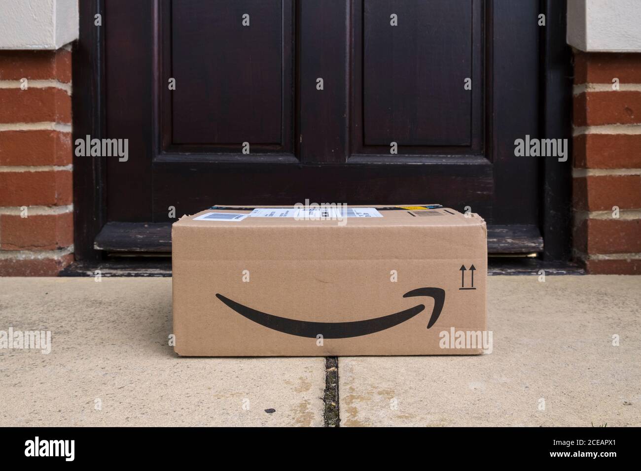 Amazon parcel delivered and left at the door. Stock Photo