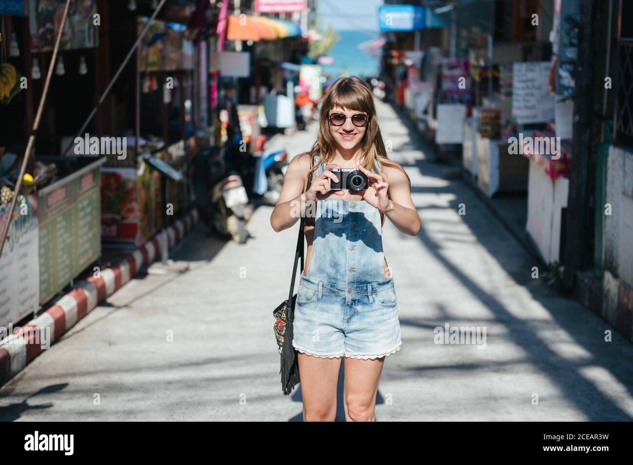 Woman standing to camera hi-res stock photography and images - Alamy