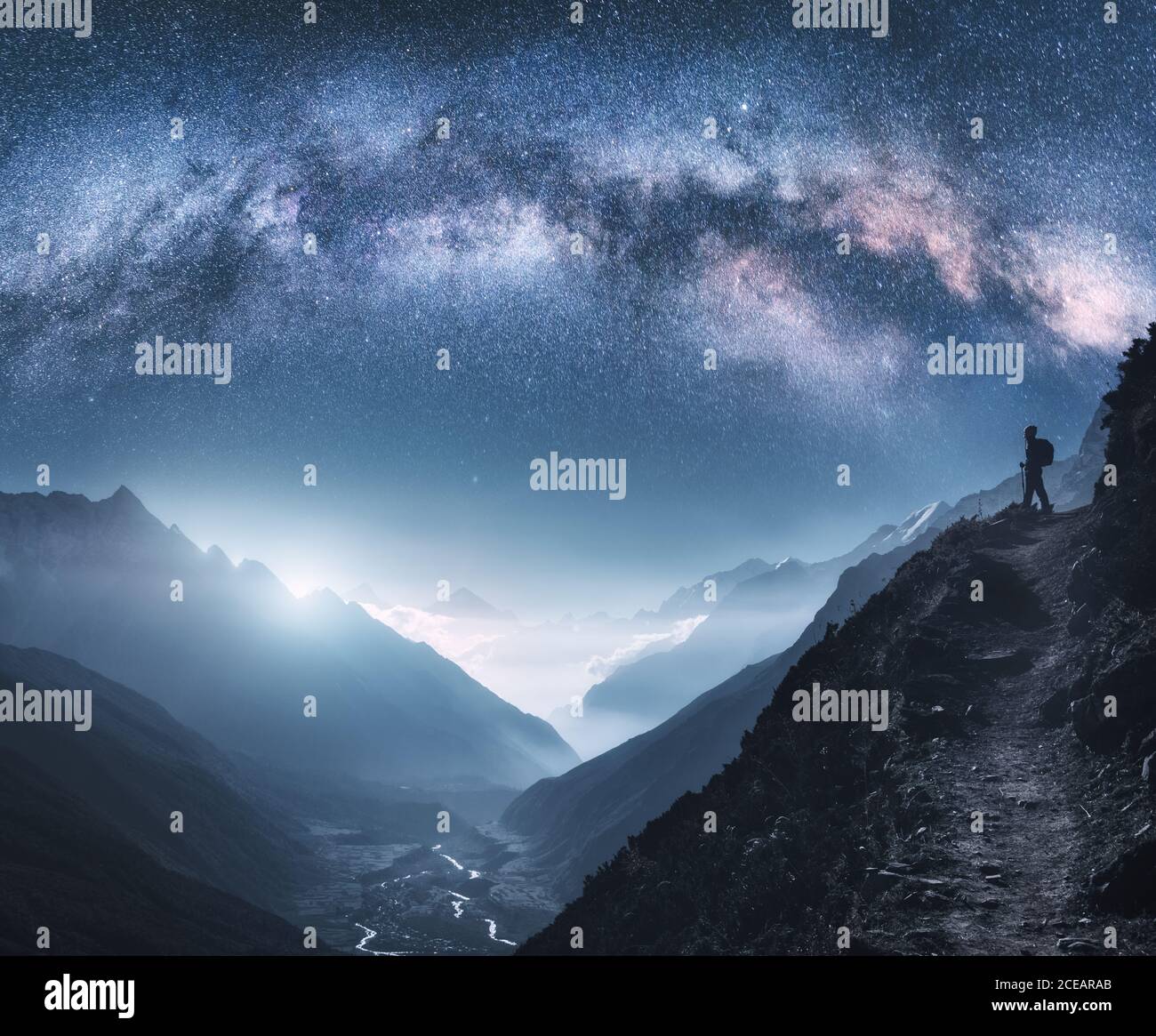 Woman lying on top of a night car in the starlight. Shot taken in the  Sierra del Segura, province of Albacete in Spain Stock Photo - Alamy