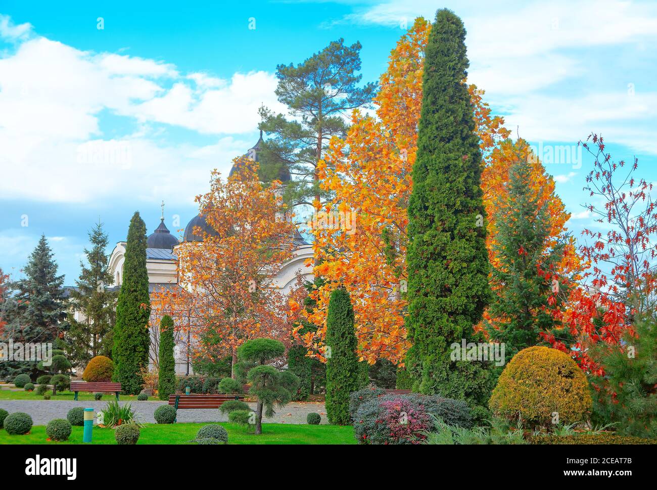 Church park in the autumn . Colorful trees and bushes in the fall Stock ...