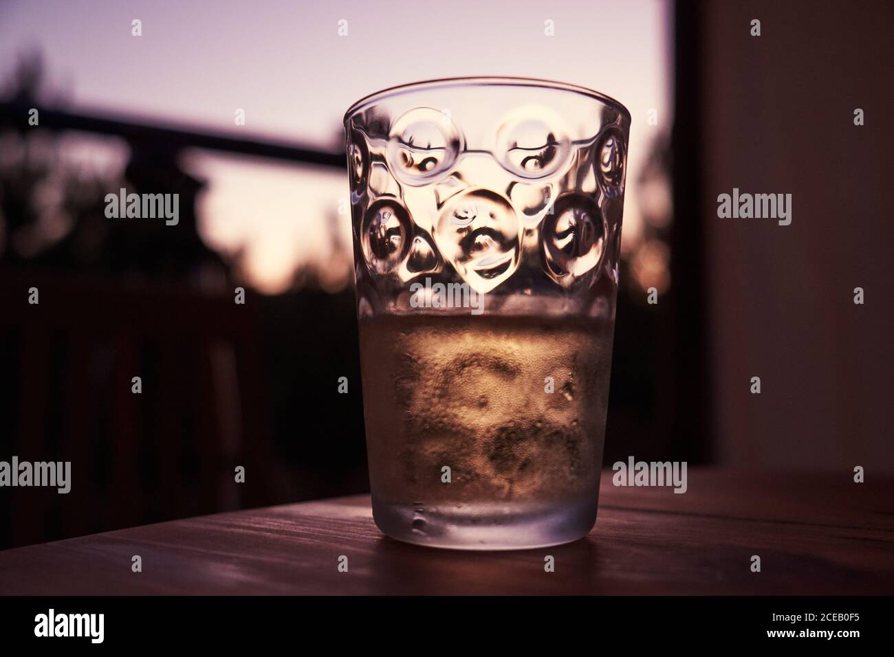 Glass with beverage on table Stock Photo