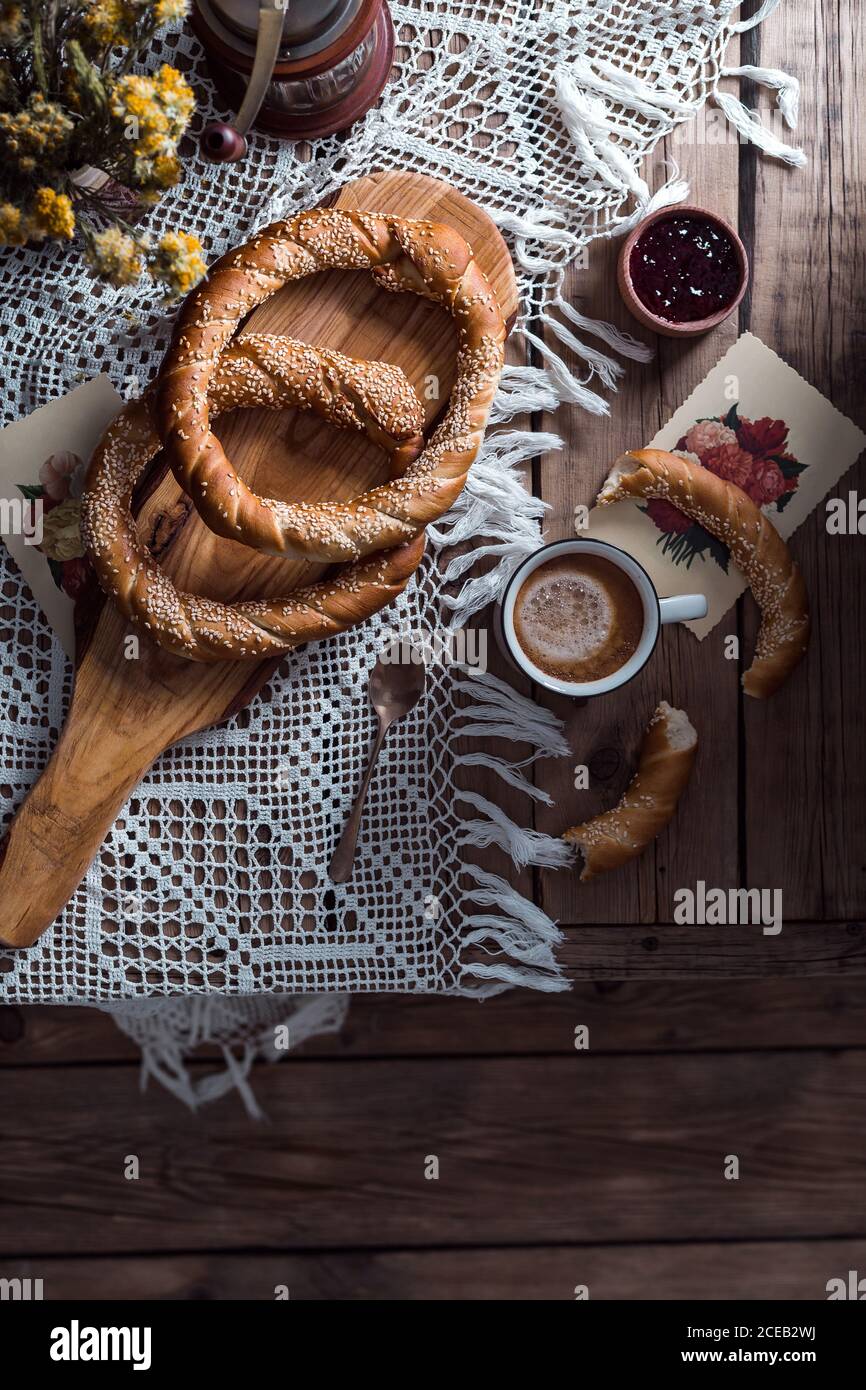Top view of tasty circle-shaped pastry and cup of cocoa on the table. Stock Photo