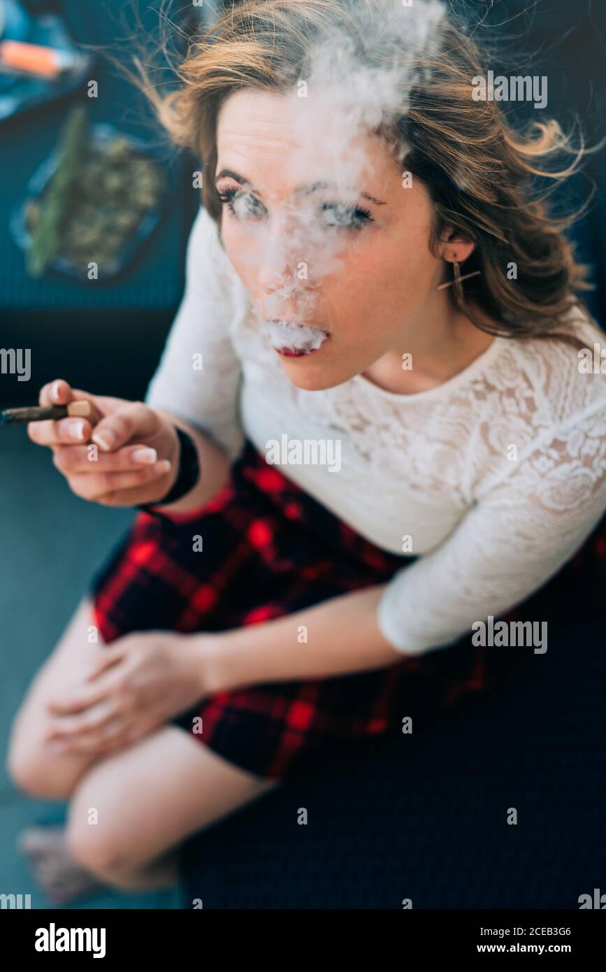 Young Woman smoking a cannabis joint Stock Photo Alamy
