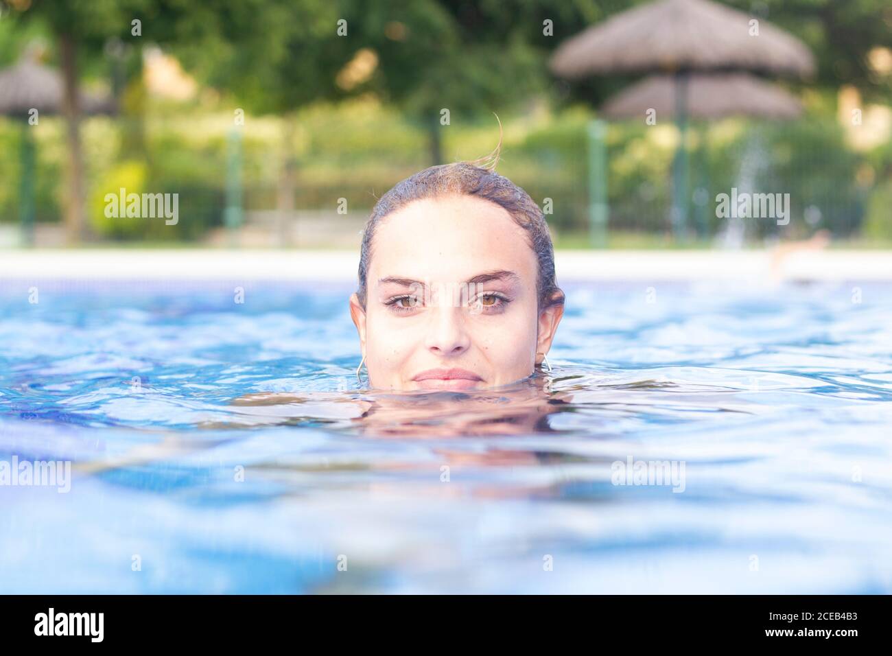 Woman swimming in pool hi-res stock photography and images - Alamy