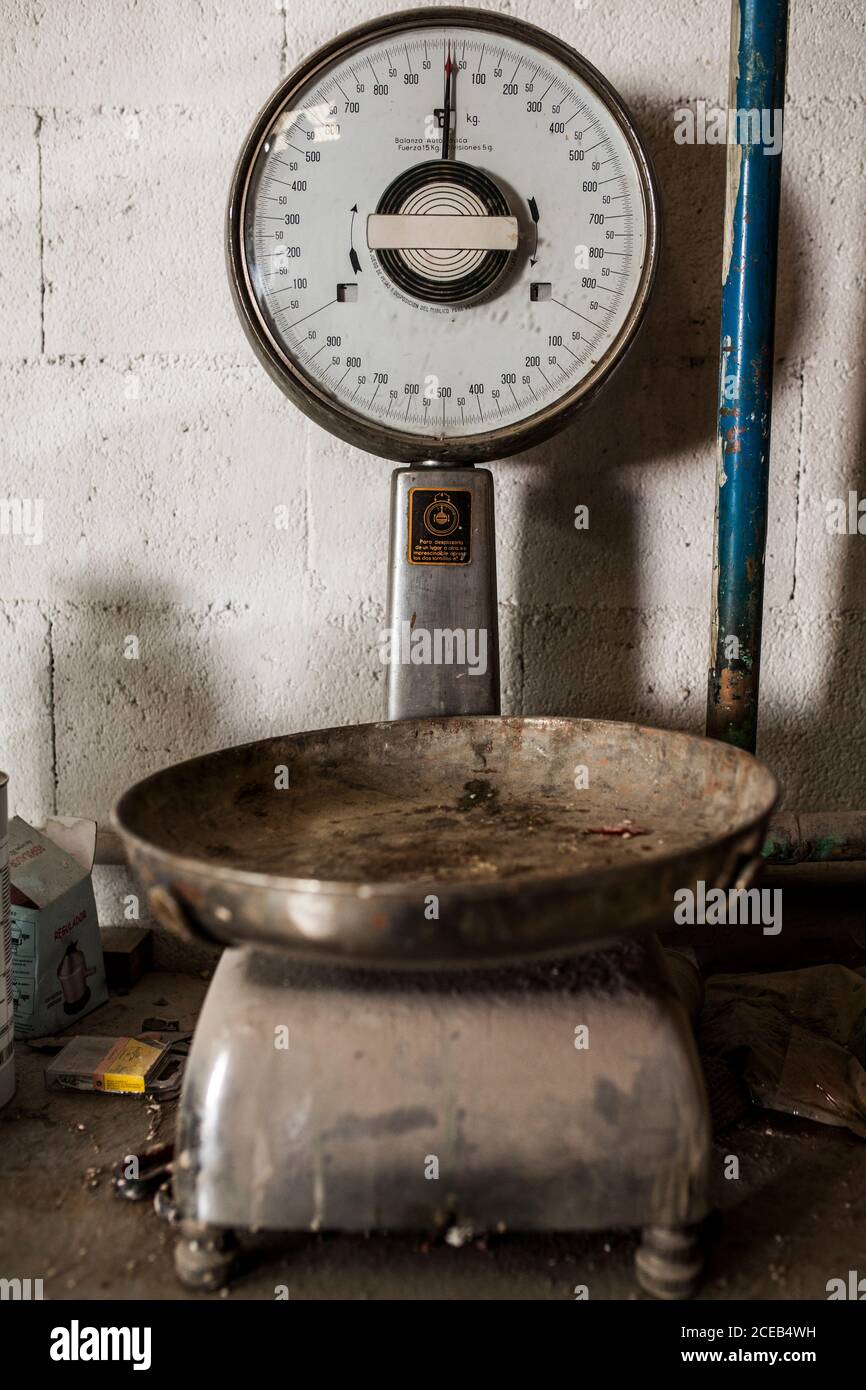 Crop view of older weighing machine standing in metal casting factory Stock Photo