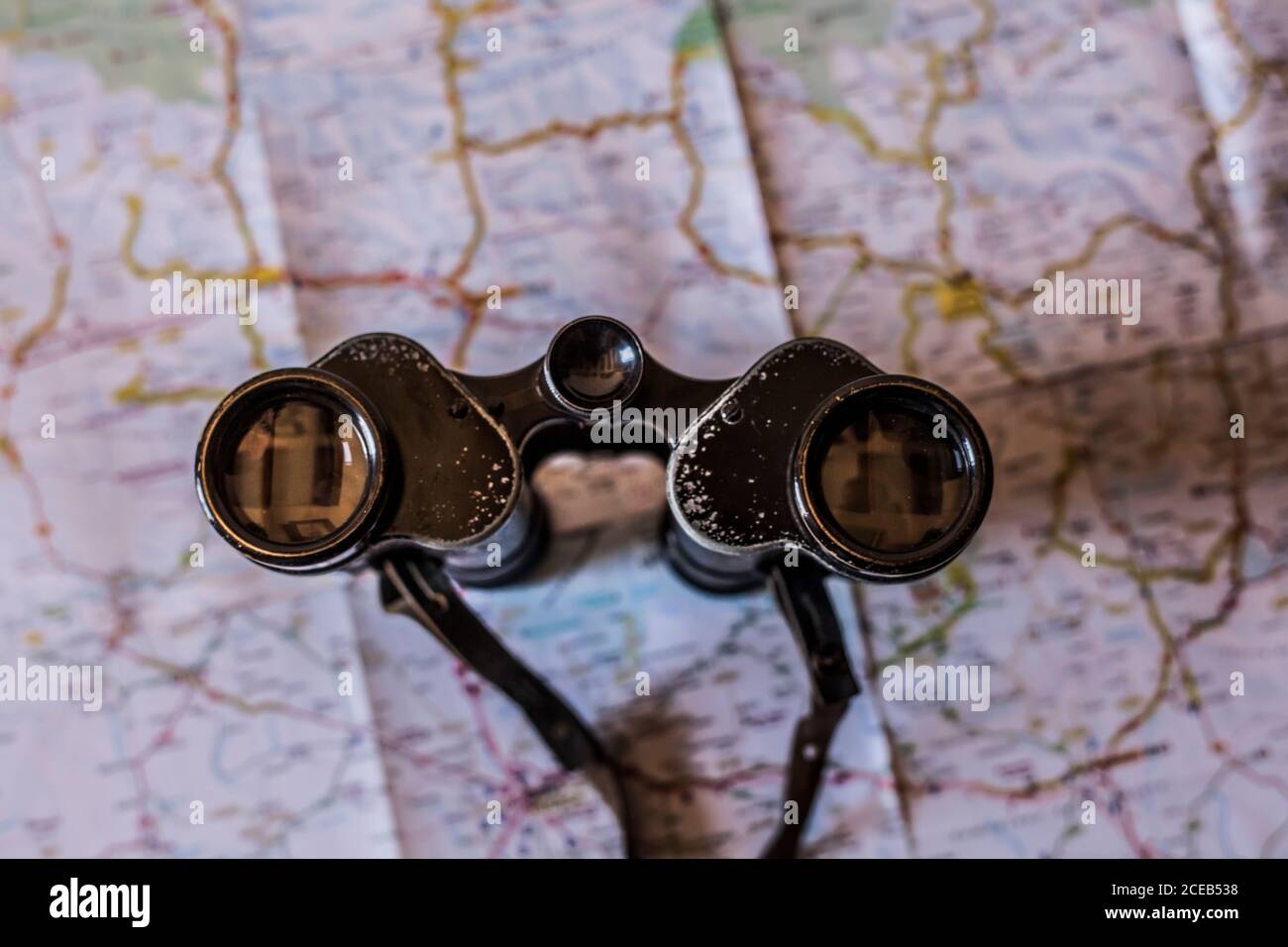 planning a trip on a map with old prismatic Stock Photo