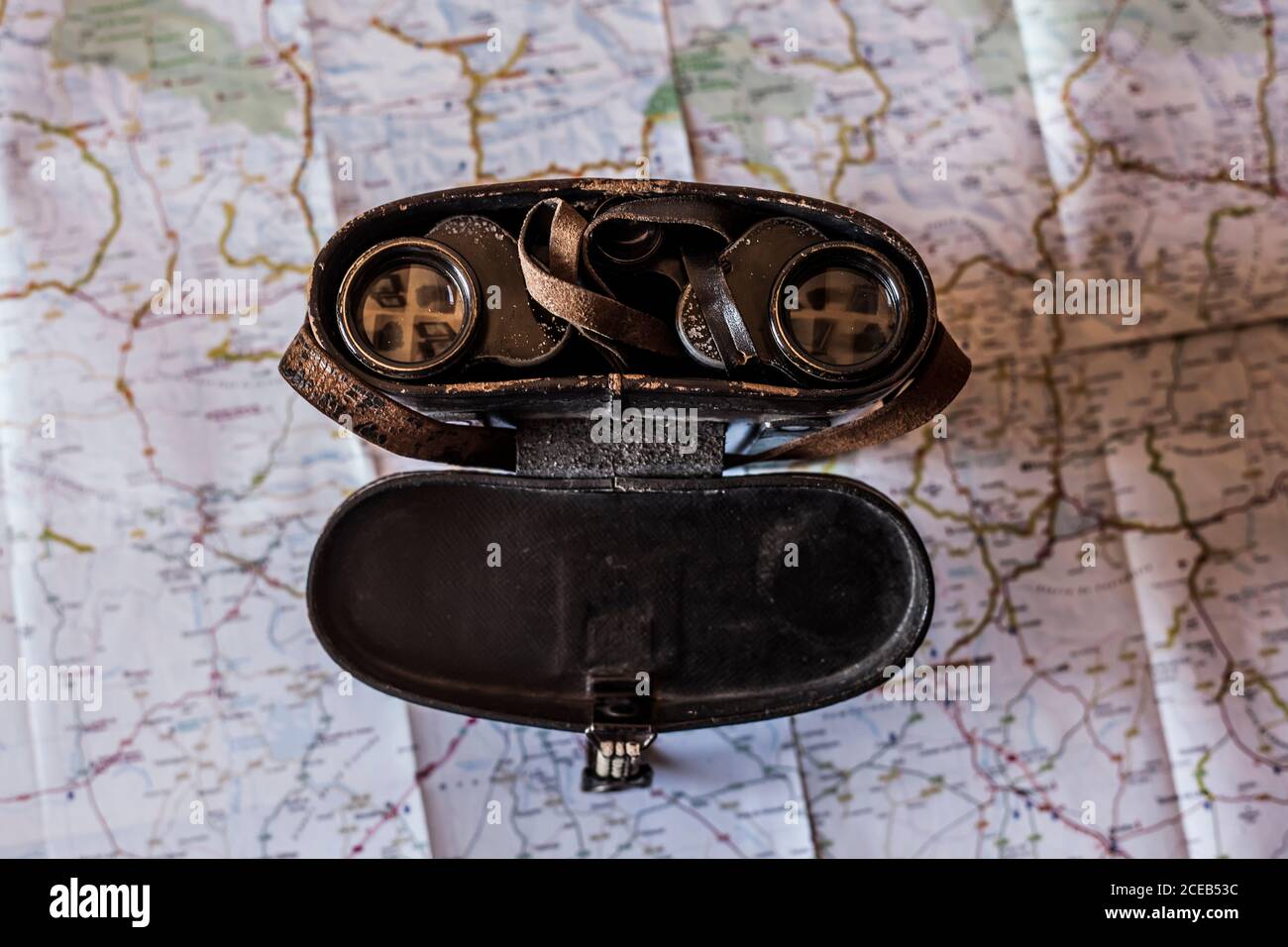 planning a trip on a map with old prismatic Stock Photo