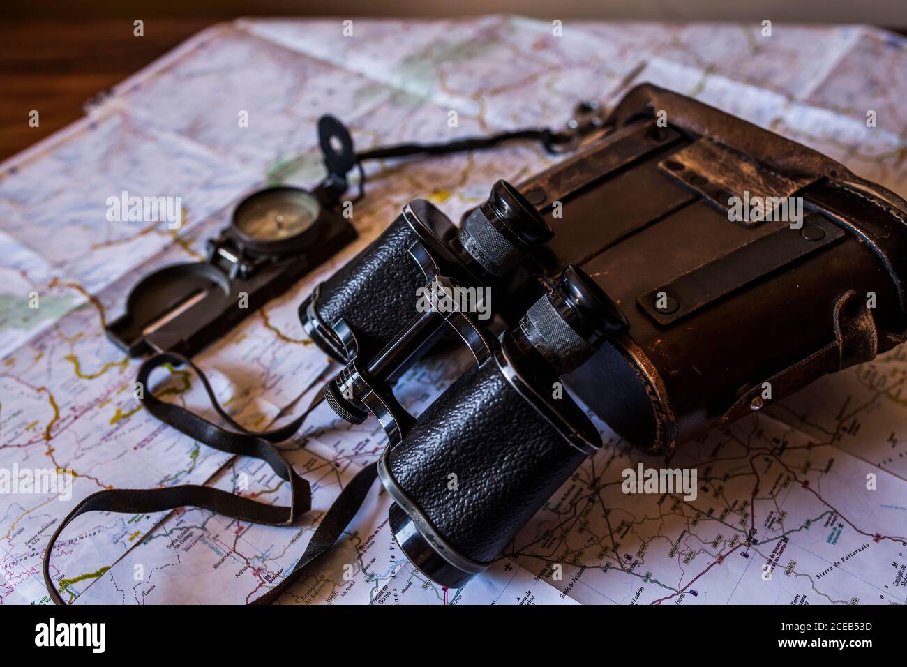planning a trip on a map with prismatic and compass Stock Photo