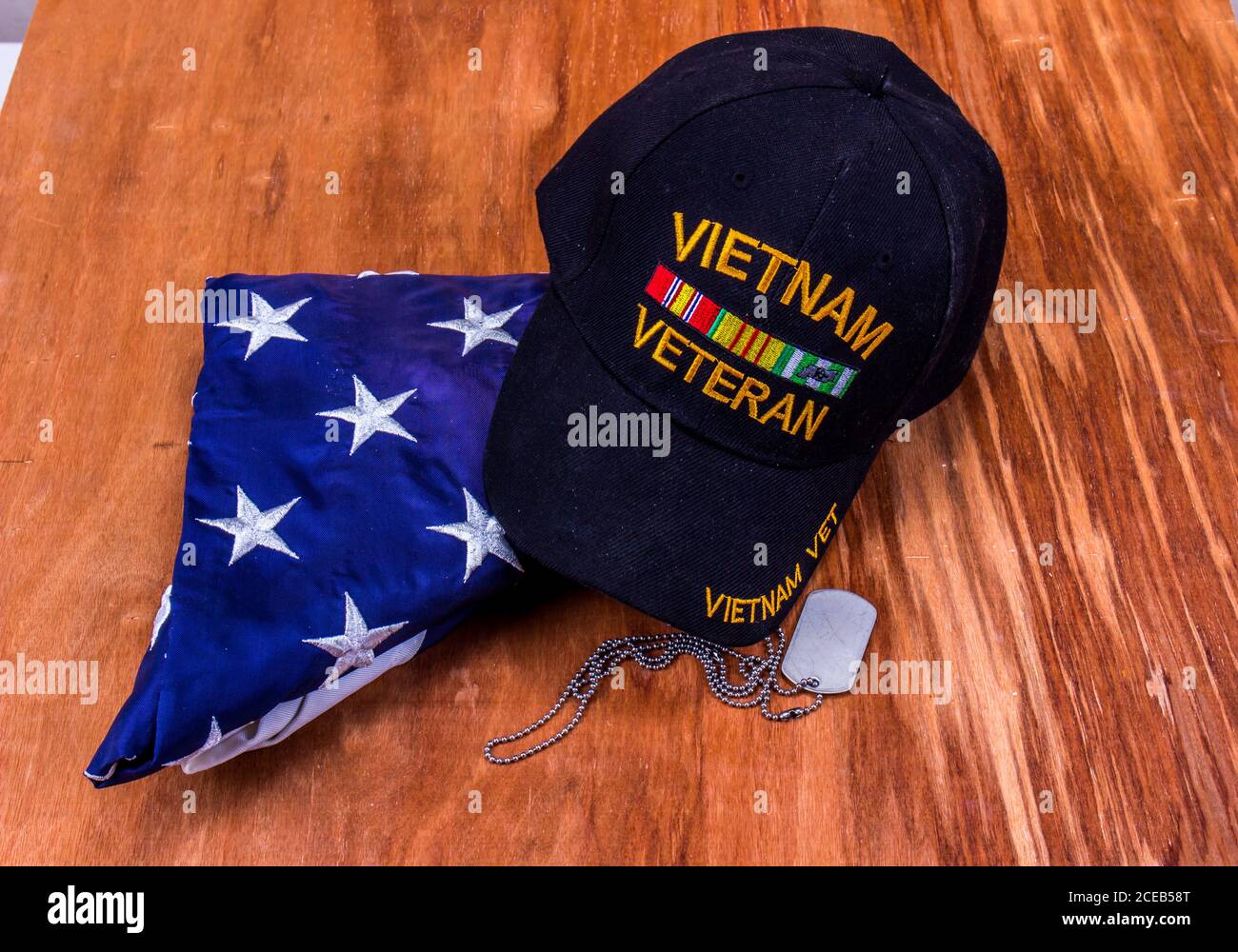 Vietnam Veteran Ball Cap, Dog Tags And American Flag Stock Photo - Alamy