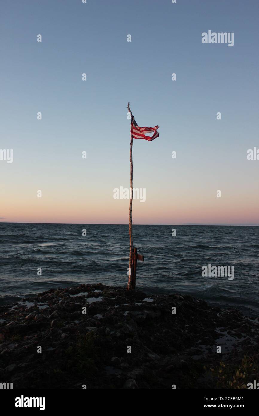 Sunset with Flag in Michigan UP Stock Photo