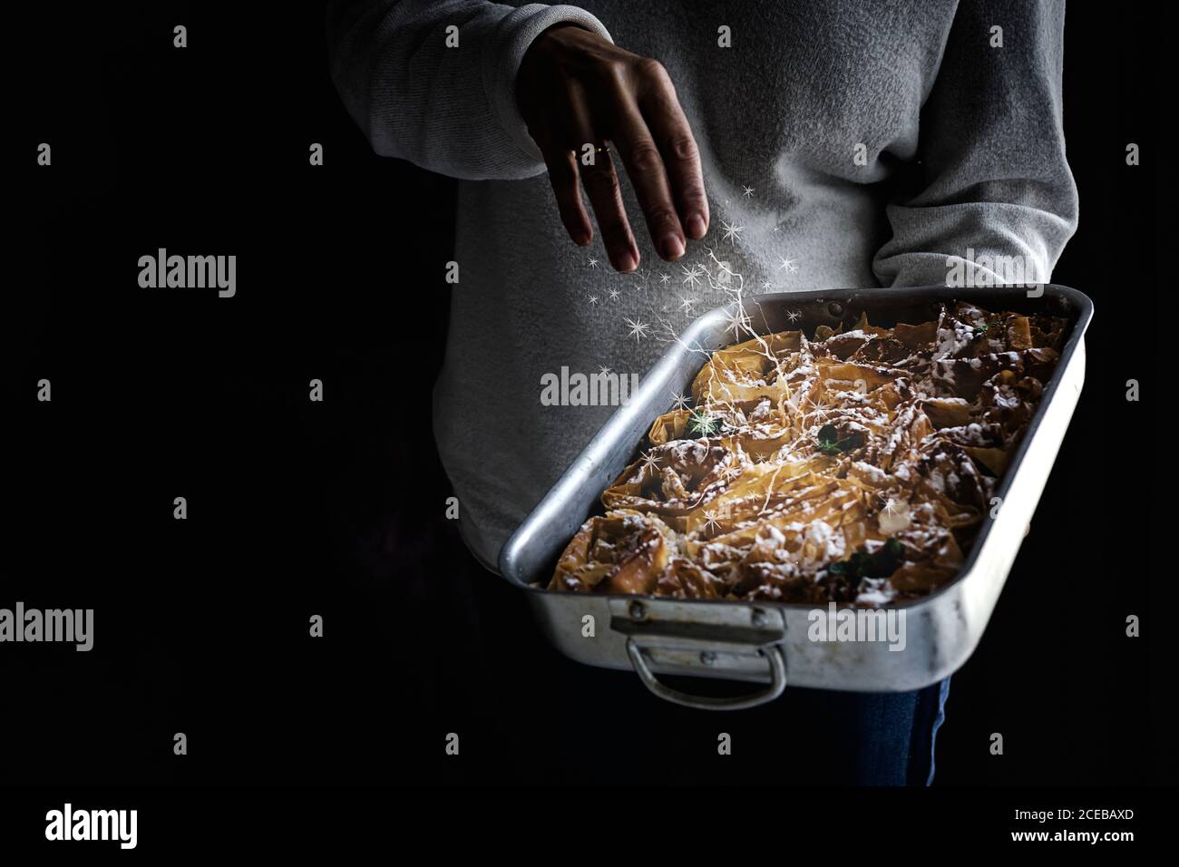 Filo dough with flower shape with hands of unrecognizable Woman doing magic Stock Photo