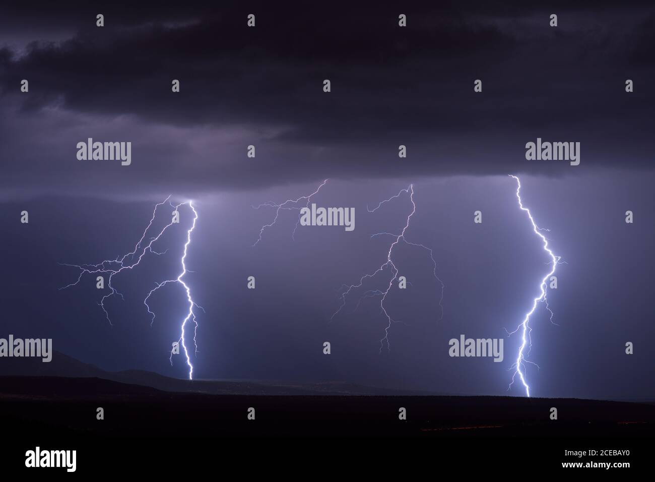 Dramatic night sky with lightning bolts strike from a thunderstorm in the Verde Valley, Arizona, USA Stock Photo