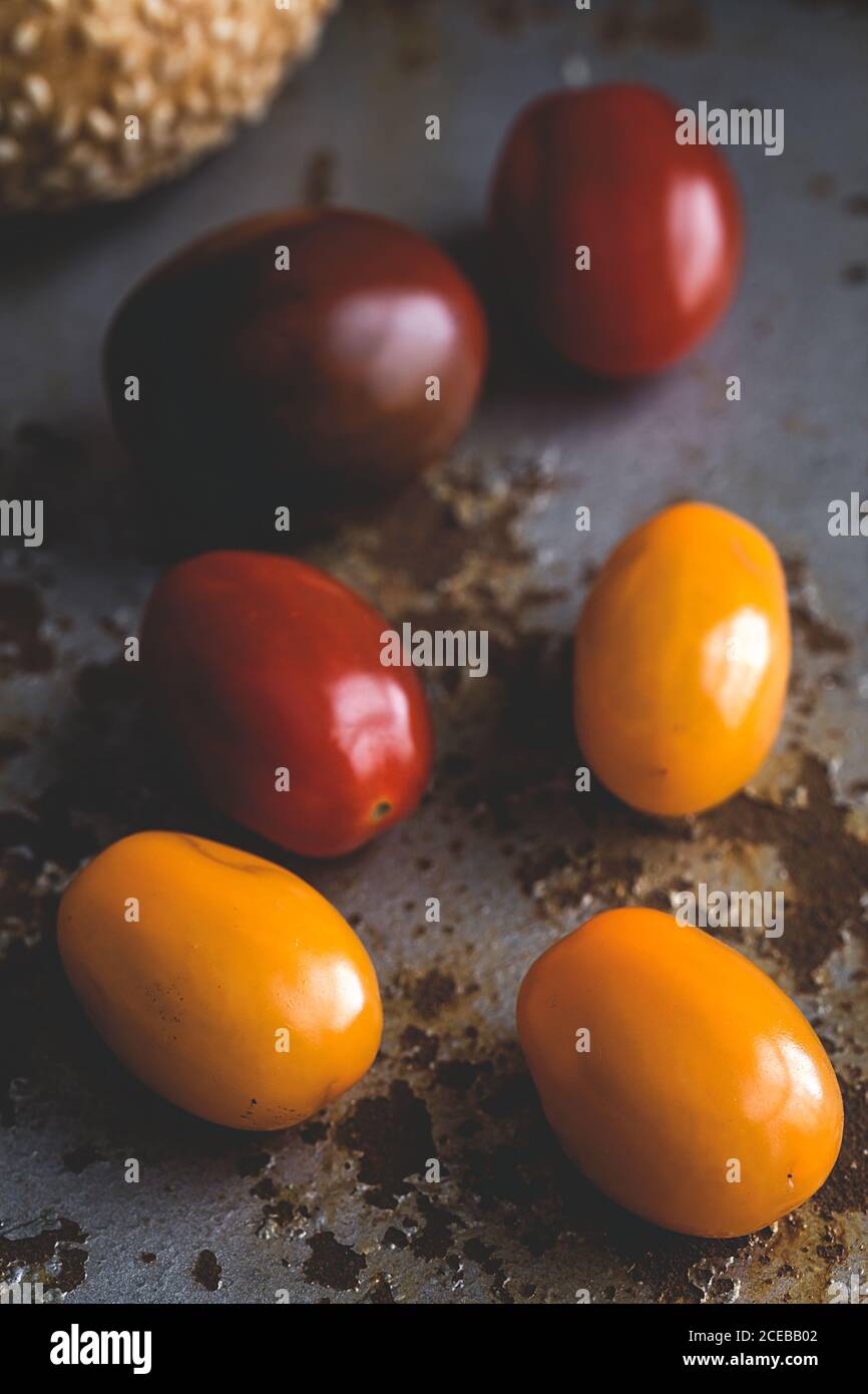Tomatoes; fresh vegetables on black background Stock Photo