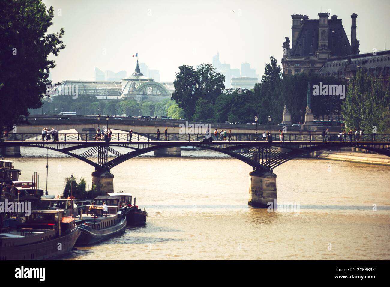 Bridge falling over brown river Seine in Paris on background of ...