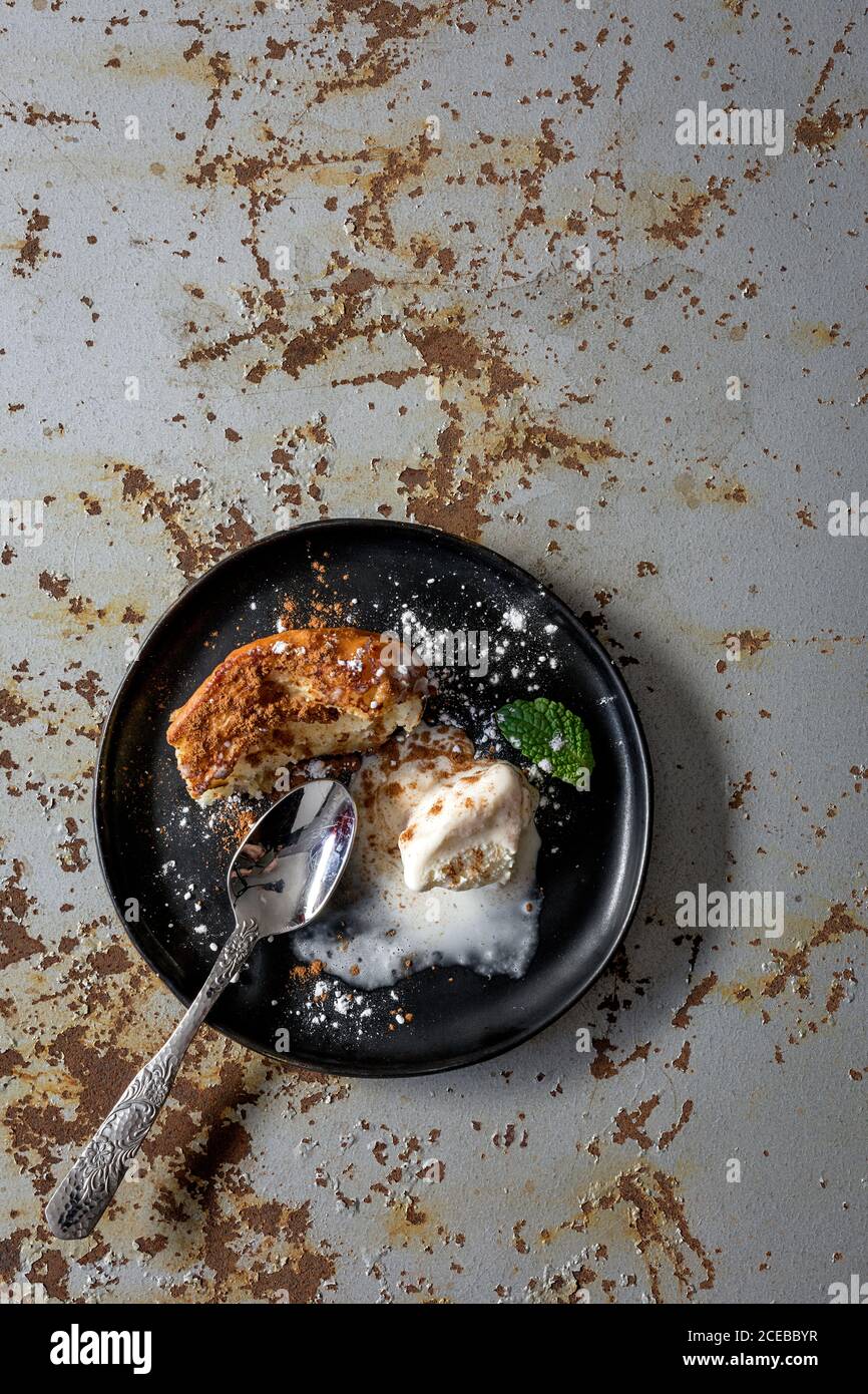 French toast with vanilla ice cream, cinnamon and mint. Flat lay. Top