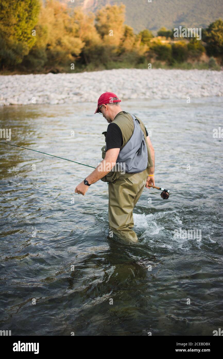 Man in waders hi-res stock photography and images - Page 2 - Alamy