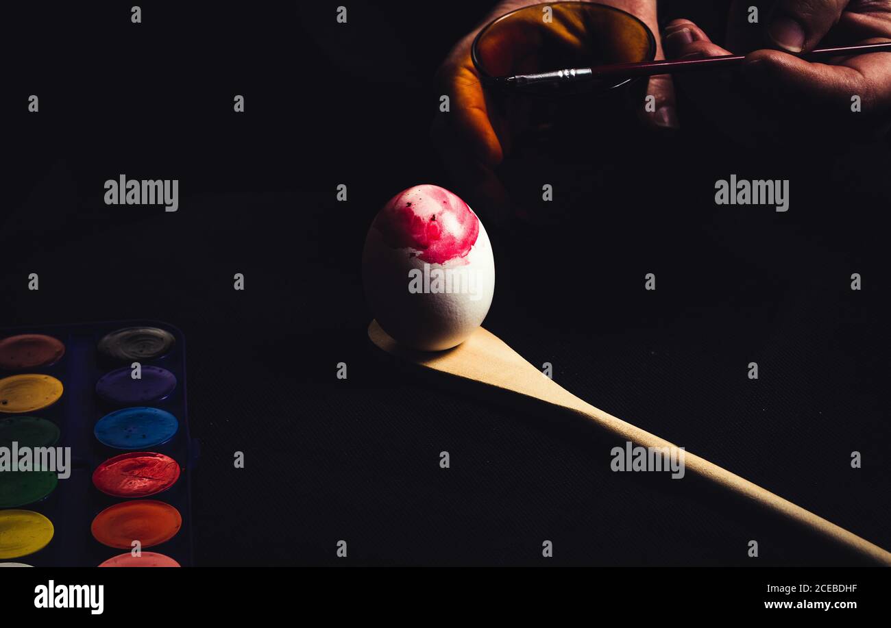Crop hand painting Easter egg Stock Photo