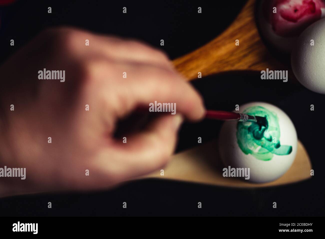 Crop hand painting Easter egg Stock Photo