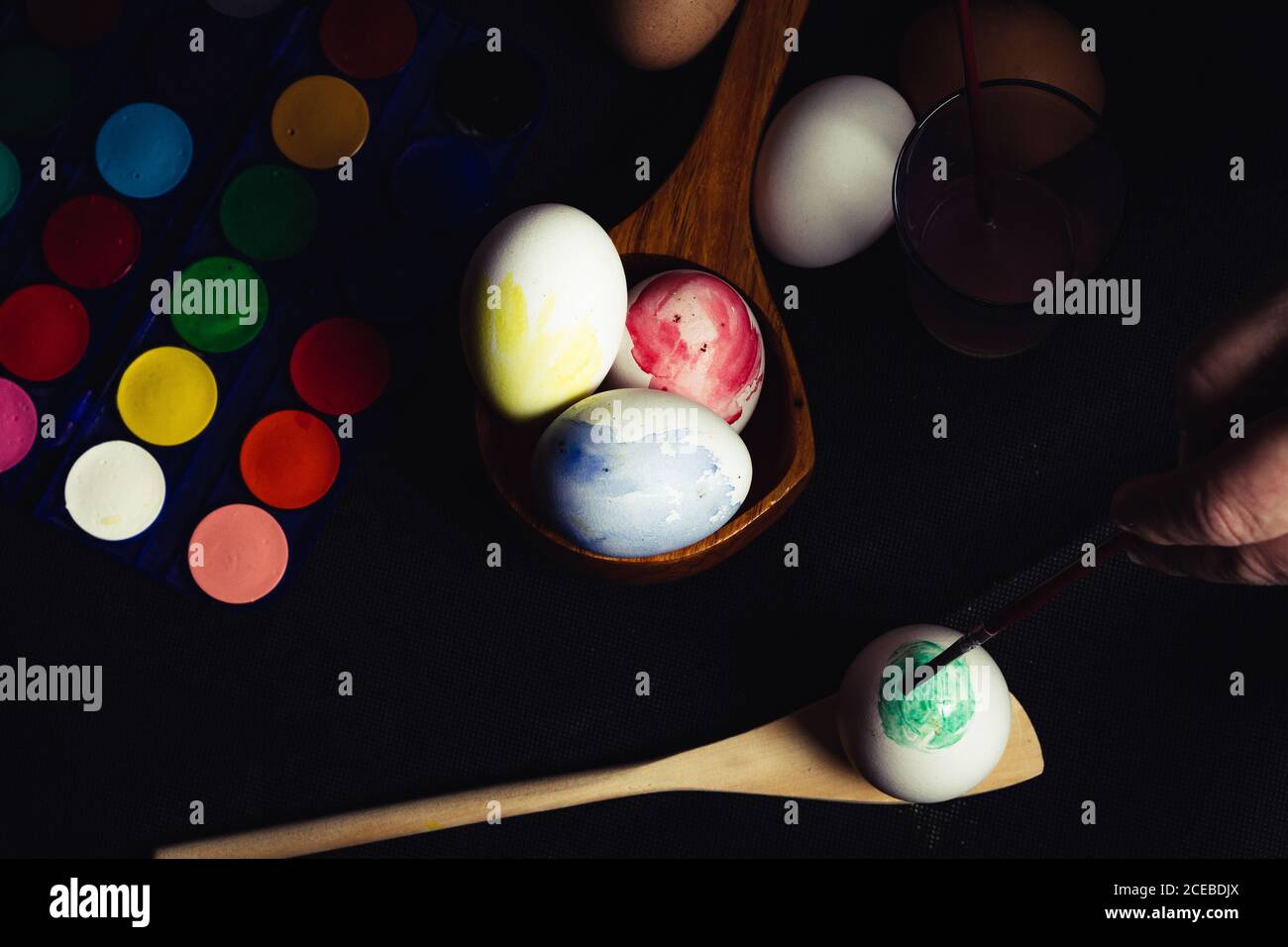 Crop hand painting Easter egg Stock Photo