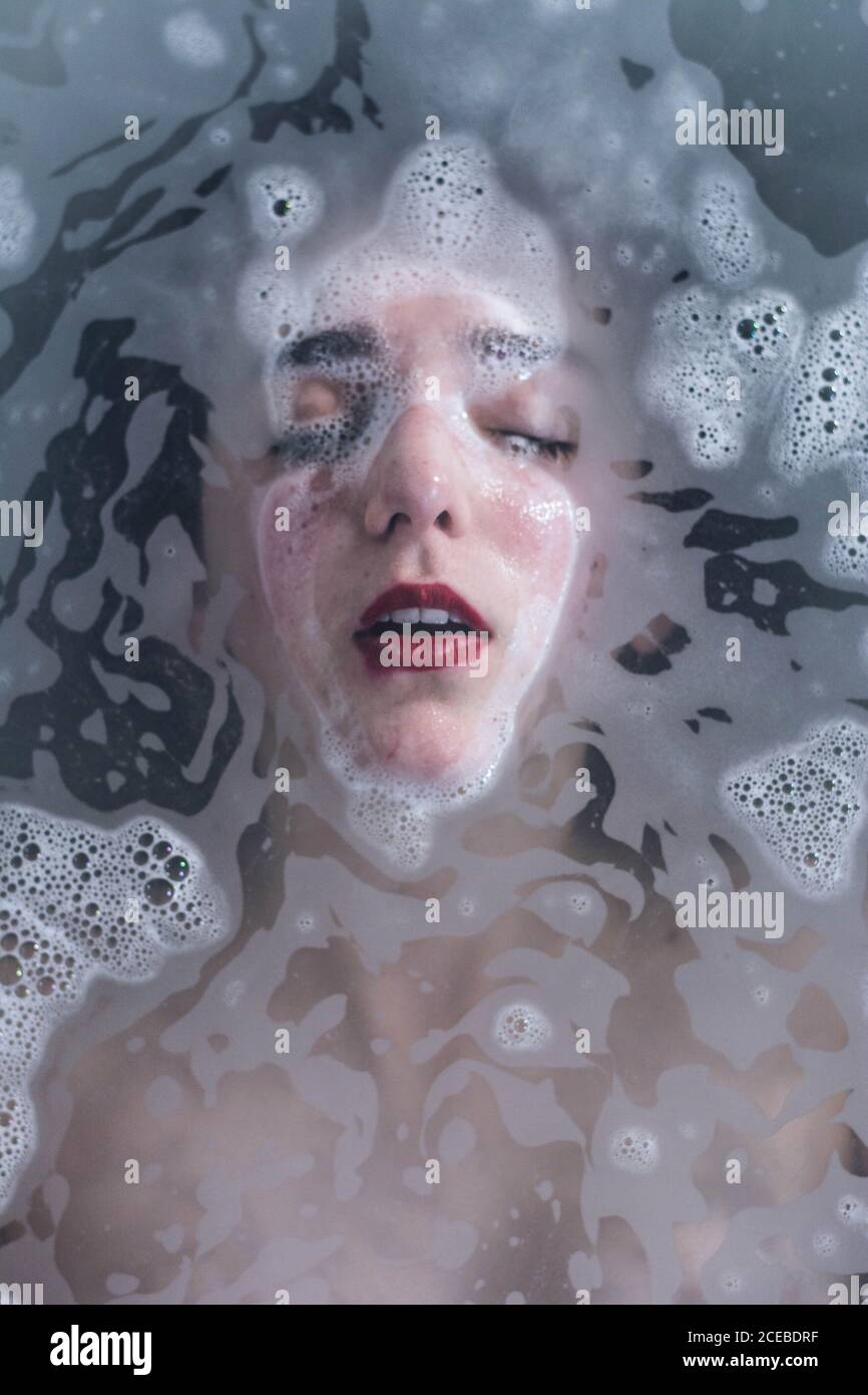 Sensual wet Woman with red lips Stock Photo - Alamy