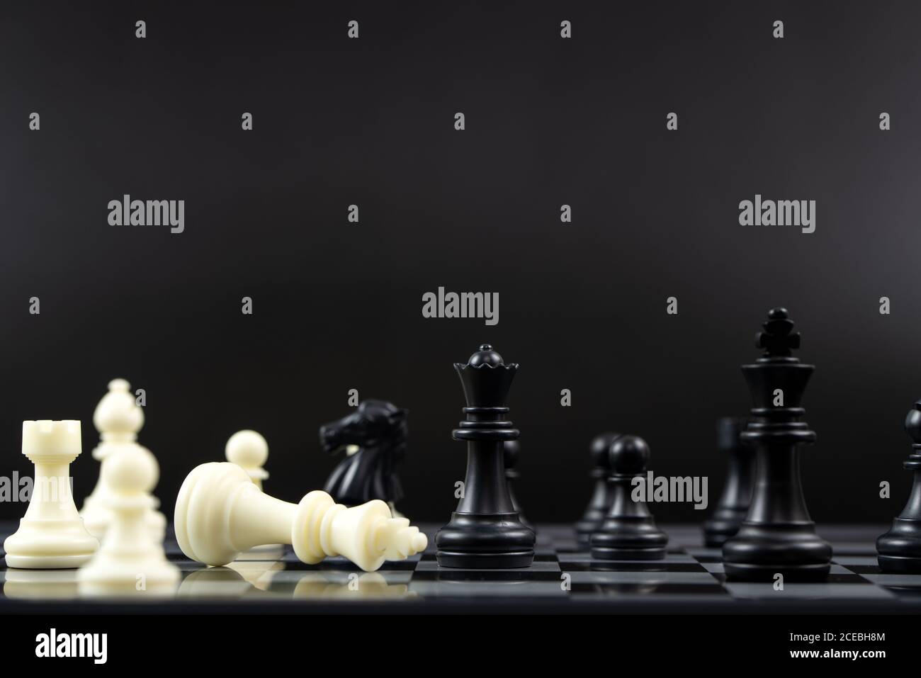 Black chess team win over white chess team Stock Photo