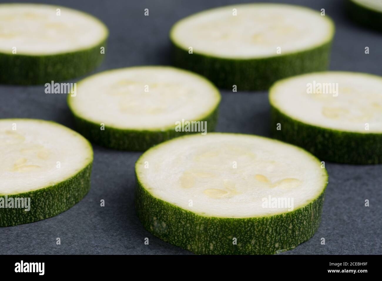 group of green zucchini slices closeup selective focus Stock Photo