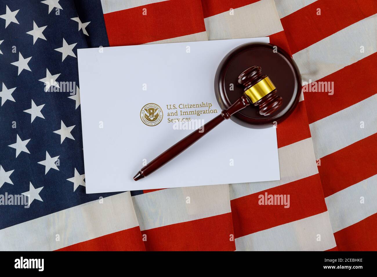 Judge's gavel, lawyers office deportation U.S. Citizenship and Immigration Services of naturalization with USA flag Stock Photo