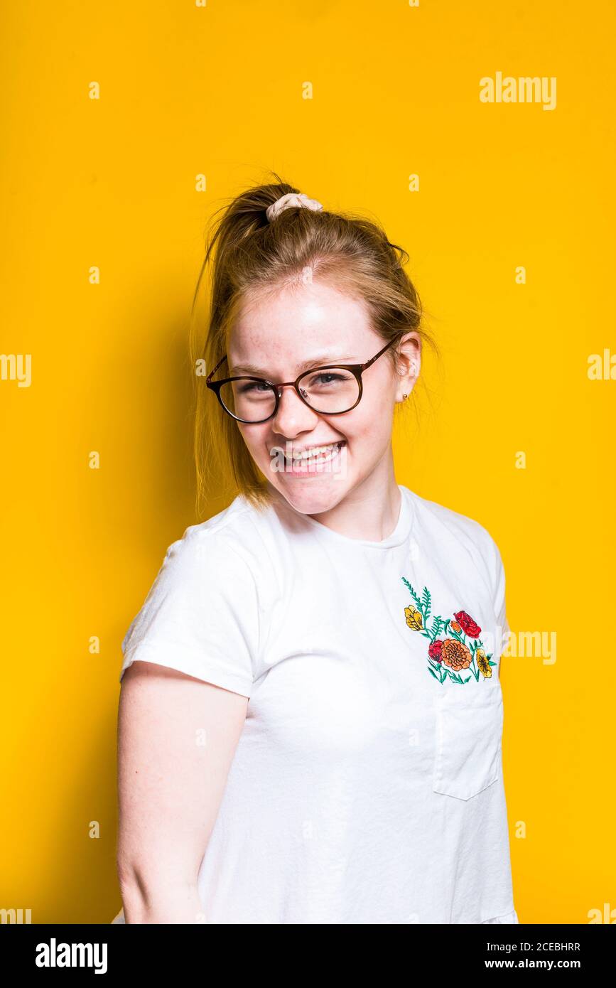 Blonde Woman posing in wall Stock Photo
