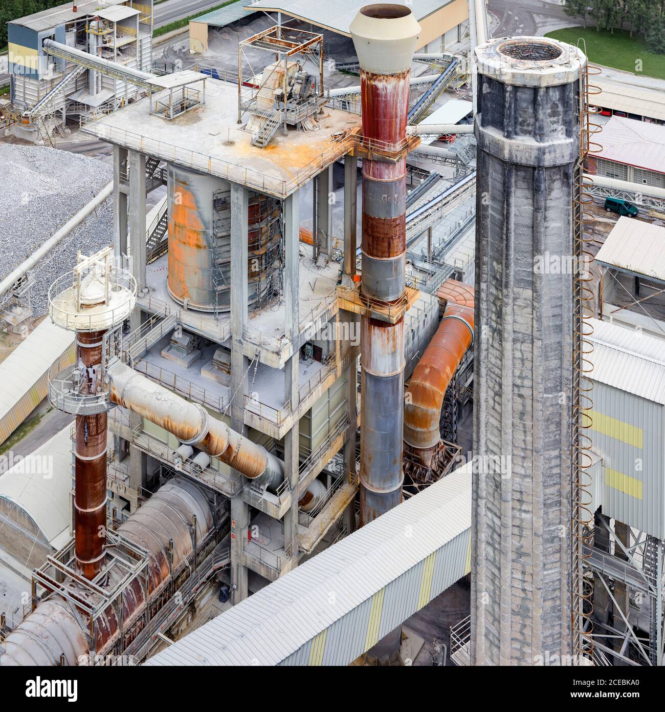 Drone view rusty fume pipes modern cement factory asturias hires stock