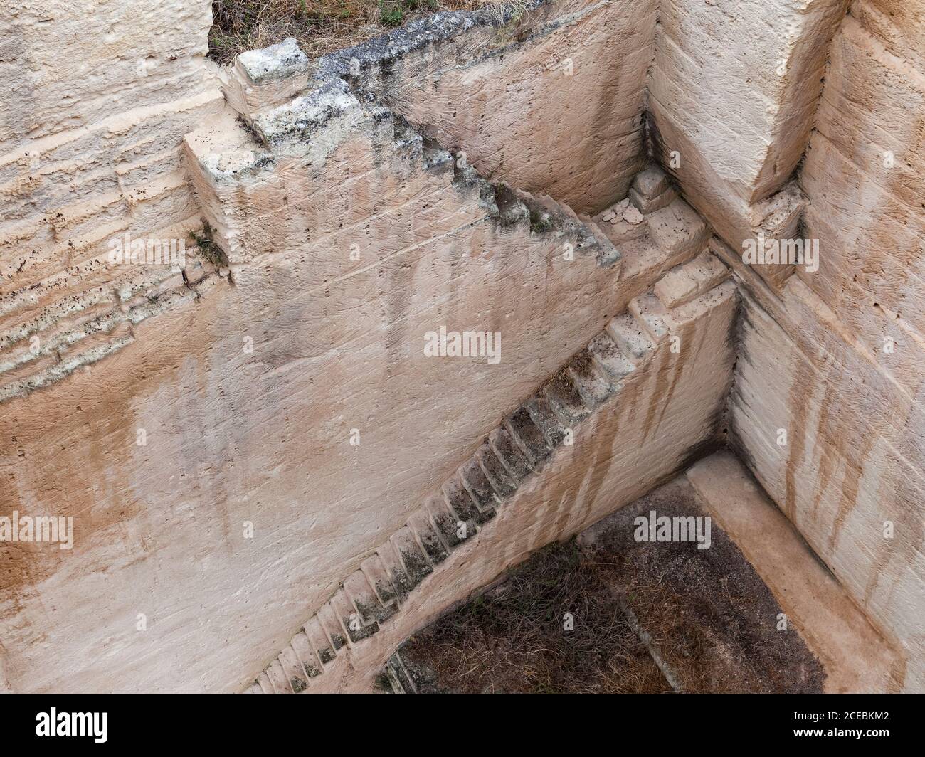 Steps in rough stone quarry Stock Photo - Alamy