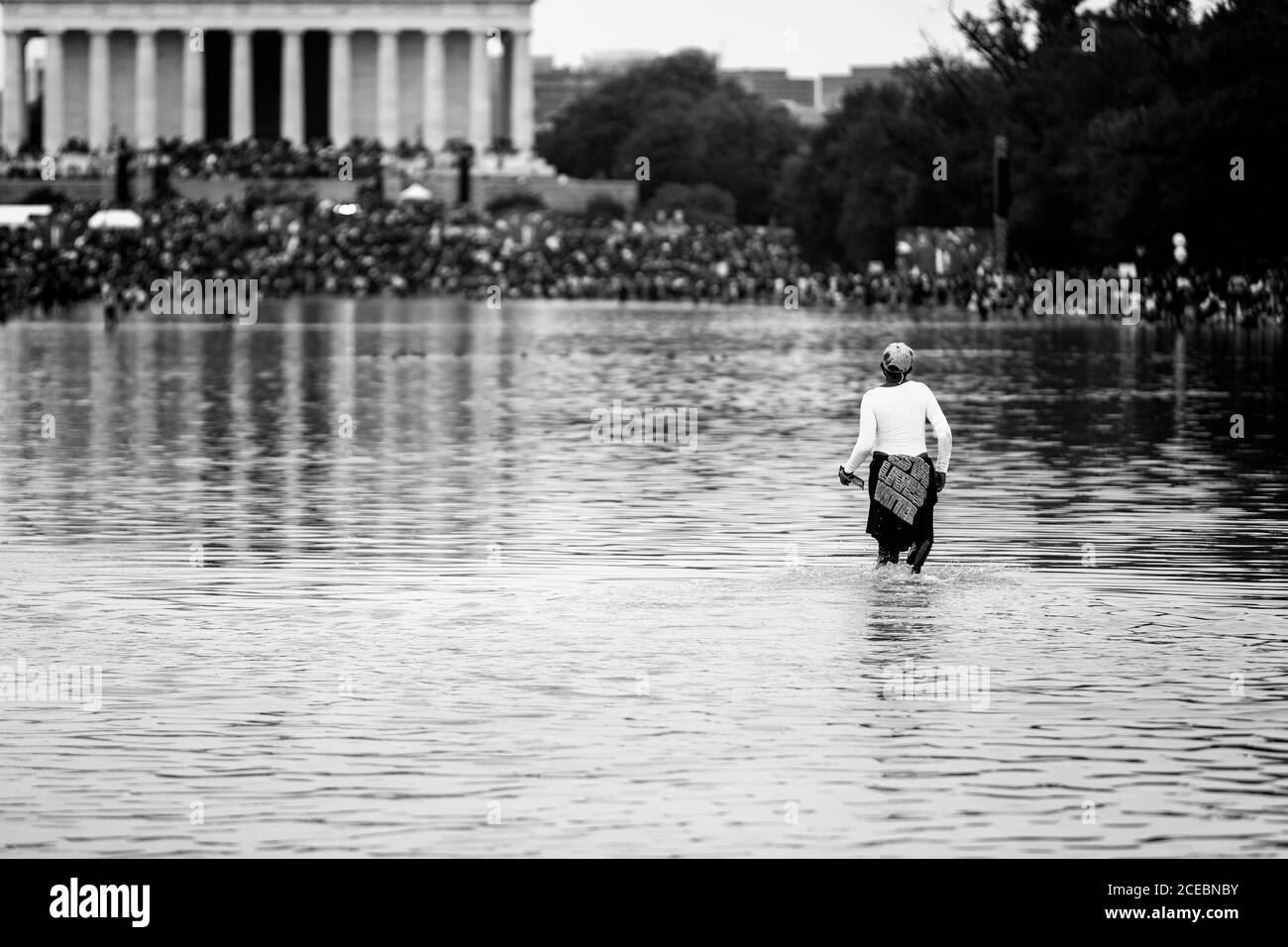 Washington, DC, USA, 28 August, 2020.  Pictured: Many attendees of the March on Washington gave into the temptation to cool off in the Reflecting Pool Stock Photo