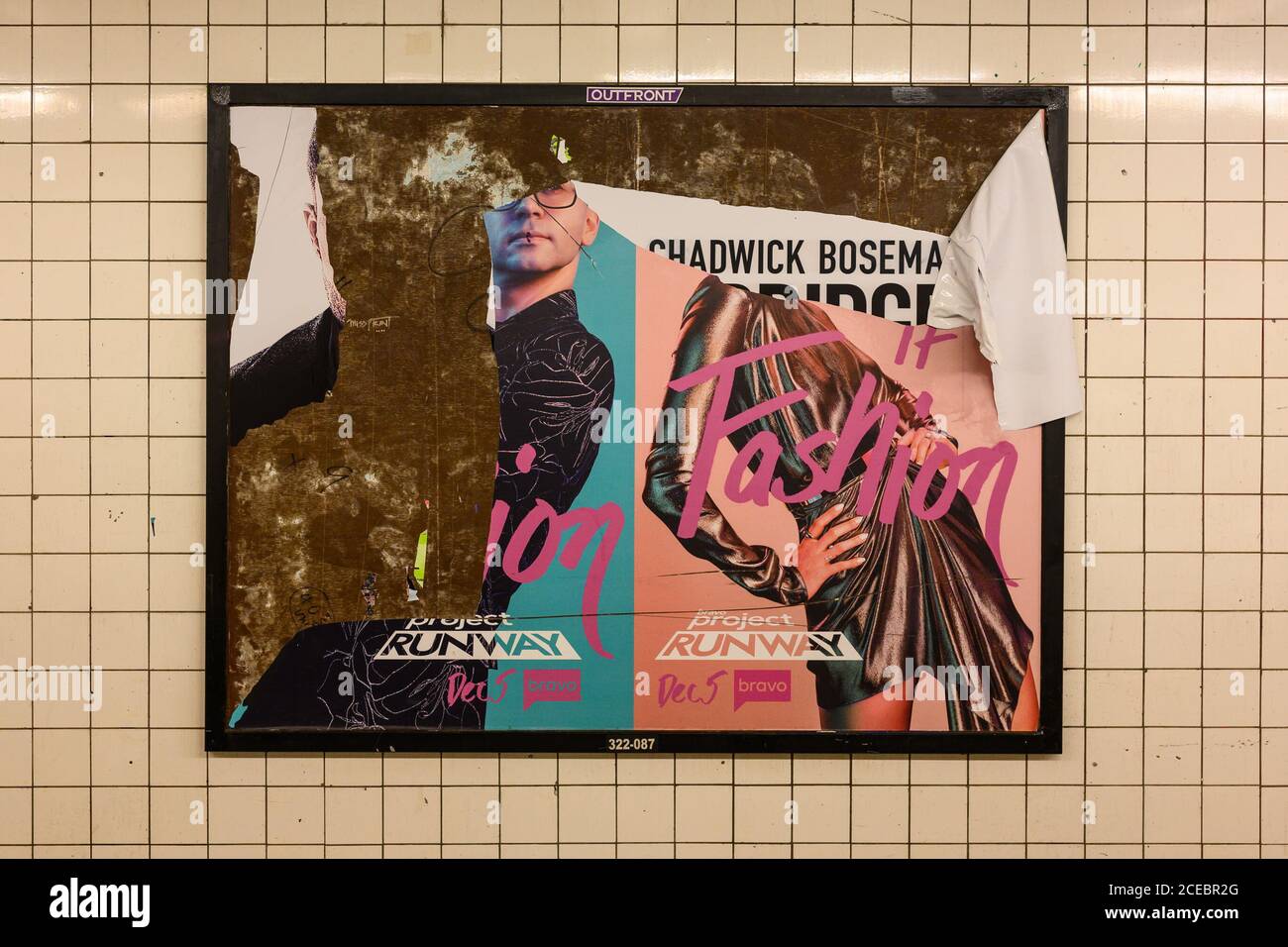 A advertisement for Project Runway ripped in a way to show the name of Chadwick Boseman from a previous ad. Unclear whether it was torn this way intentionally to reveal his name. Stock Photo