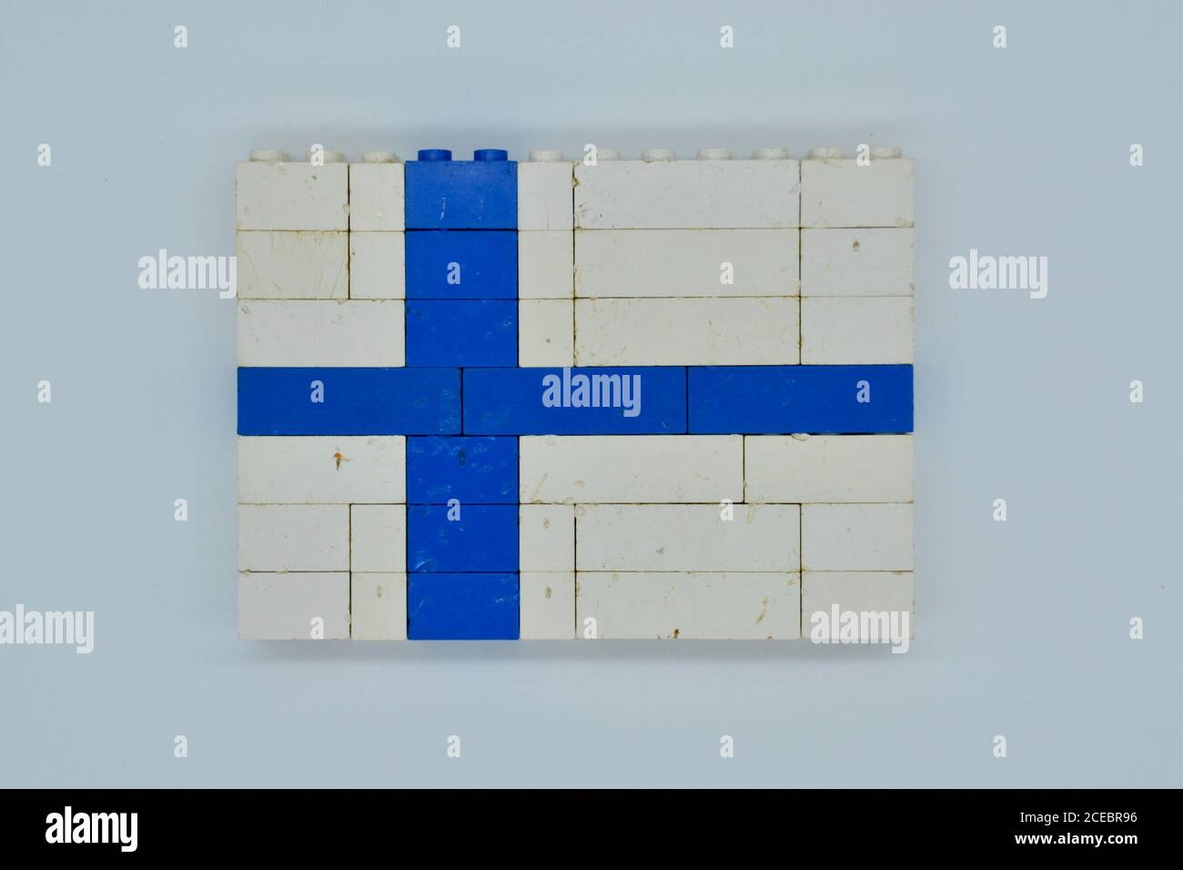 Concept national flag of Finland made from blue and white vintage plastic children's Lego building bricks Stock Photo