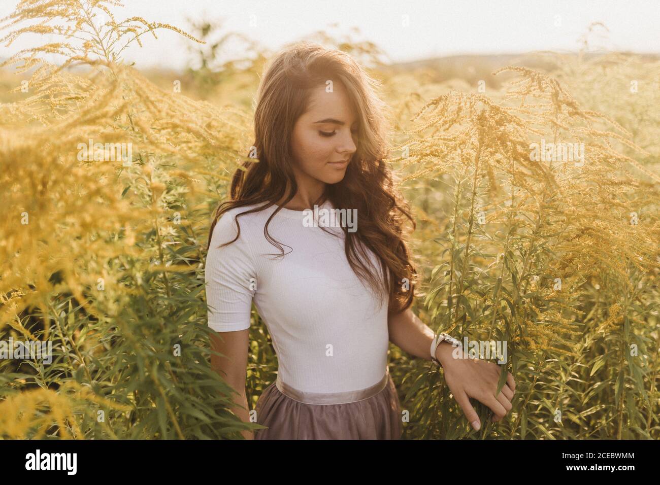 Beautiful Woman Standing In Field Stock Photo Alamy