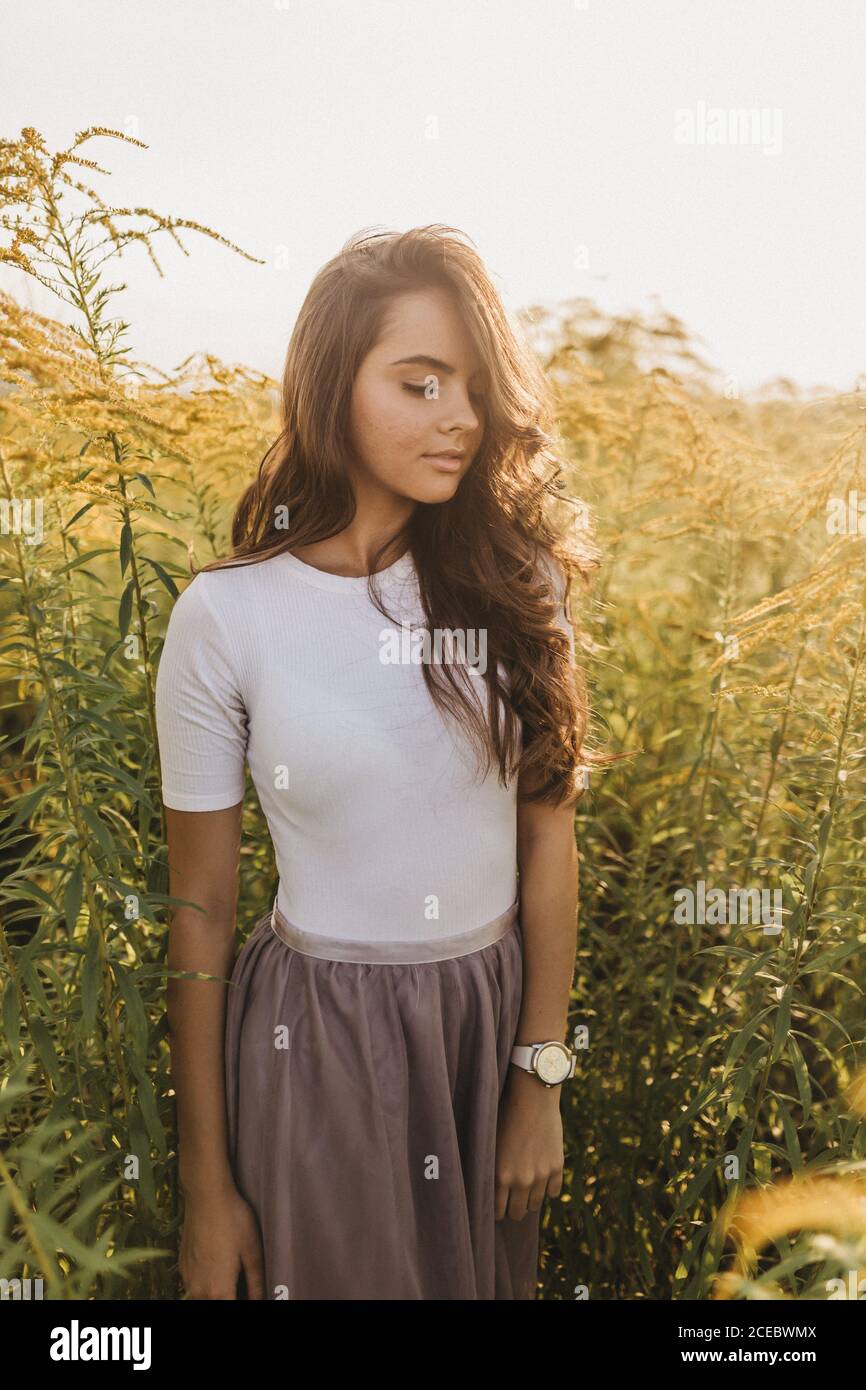 Beautiful woman standing hi-res stock photography and images - Alamy