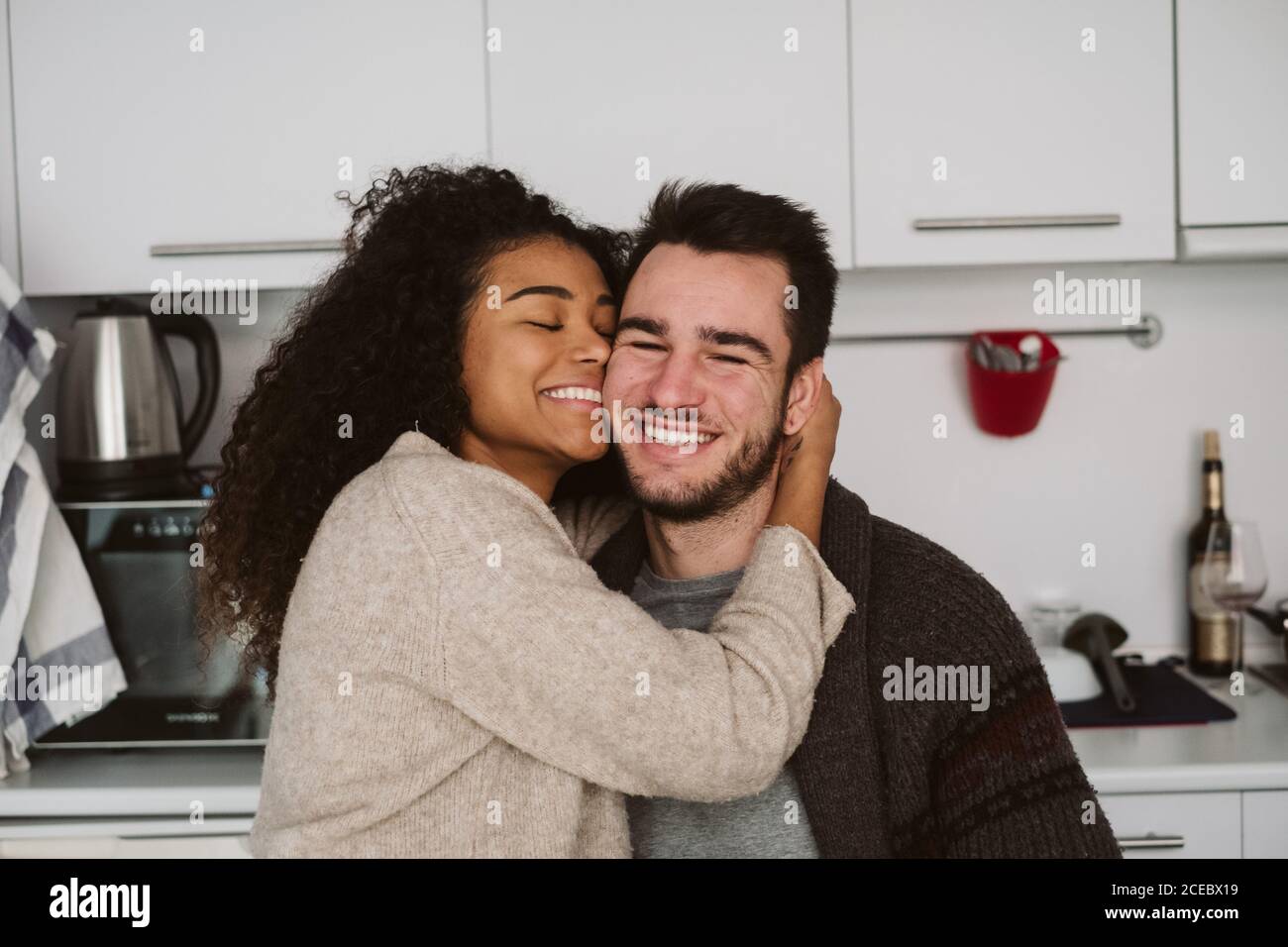 Multiethnic couple in modern kitchen Stock Photo