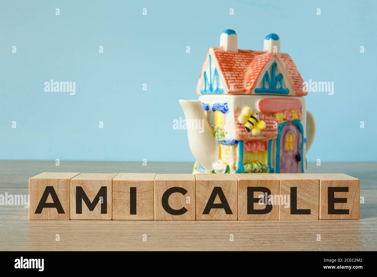 Amicable - word on wooden cubes, concept family Stock Photo