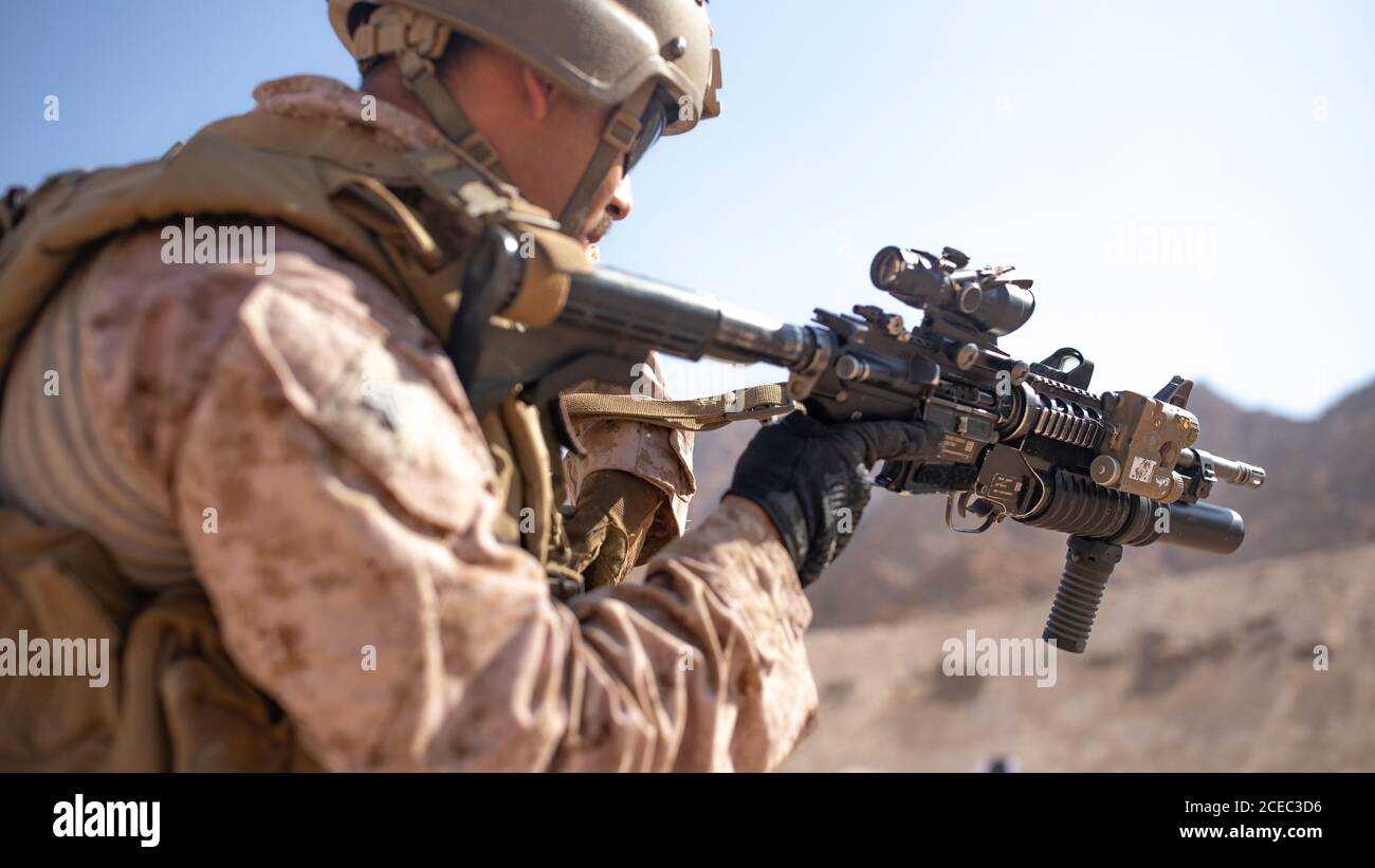 A U.S. Marine with 2nd Battalion, 5th Marine Regiment, assigned to Special Purpose Marine Air-Ground Task Force - Crisis Response - Central Command 20.2, performs a speed reload during a combat marksmanship range in Jordan, Aug. 29, 2020. The CMP range stressed the fundamentals of combat marksmanship and weapons handling. The SPMAGTF-CR-CC is a crisis response force, prepared to mobilize a variety of capabilities across the region. (U.S. Marine Corps Photo by Cpl. Robert Kuehn) Stock Photo