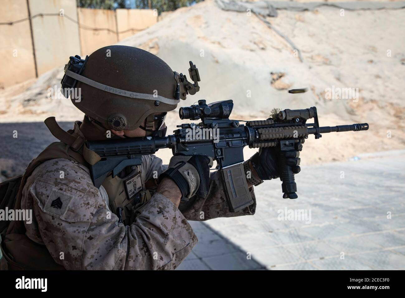 A U.S. Marine with 2nd Battalion, 5th Marine Regiment, assigned to Special Purpose Marine Air-Ground Task Force – Crisis Response - Central Command 20.2, fires his M4 Carbine during a combat marksmanship range at the Baghdad Embassy Compound in Iraq, Aug. 15, 2020. The SPMAGTF-CR-CC is a crisis response force, prepared to deploy a variety of capabilities across the region. (U.S. Marine Corps photo by Cpl. Thomas Spencer) Stock Photo