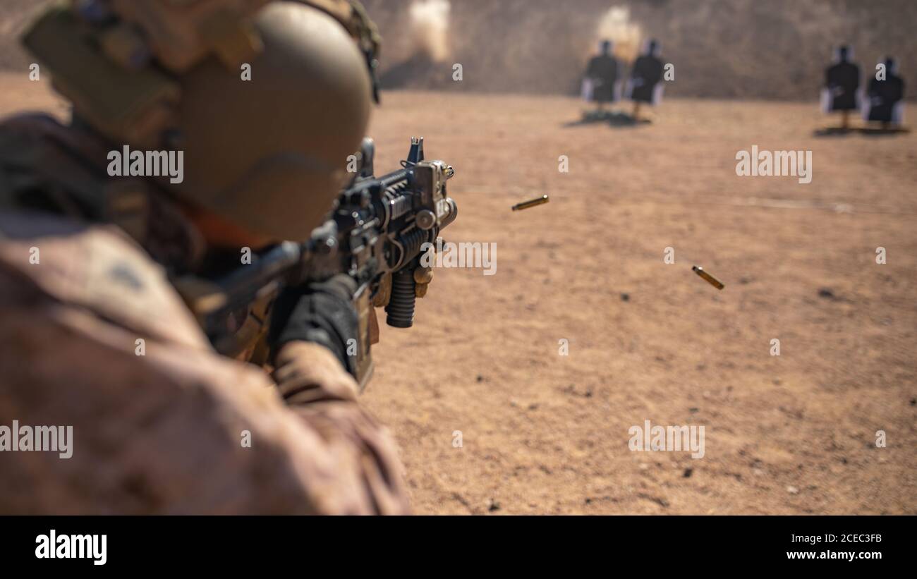 A U.S. Marine with 2nd Battalion, 5th Marine Regiment, assigned to Special Purpose Marine Air-Ground Task Force - Crisis Response - Central Command 20.2, fires his M4 Carbine during a combat marksmanship range in Jordan, Aug. 29, 2020. The CMP range stressed the fundamentals of combat marksmanship and weapons handling. The SPMAGTF-CR-CC is a crisis response force, prepared to mobilize a variety of capabilities across the region. (U.S. Marine Corps Photo by Cpl. Robert Kuehn) Stock Photo