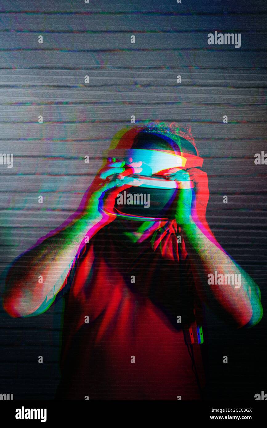 man testing VR glasses in the night Stock Photo