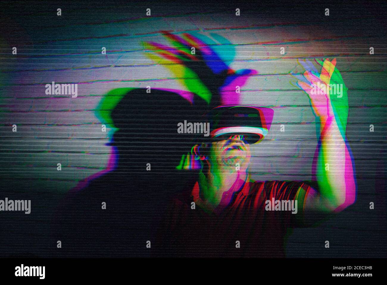 man testing VR glasses in the night Stock Photo