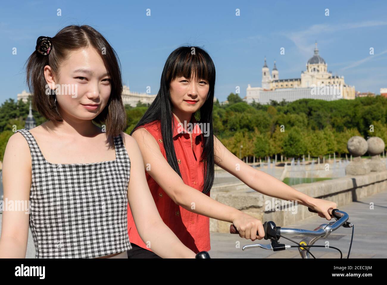 Asian people with bicycles Stock Photo - Alamy